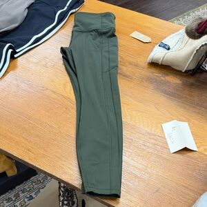 Athleta women’s Dark Olive Green ultimate stash tight M